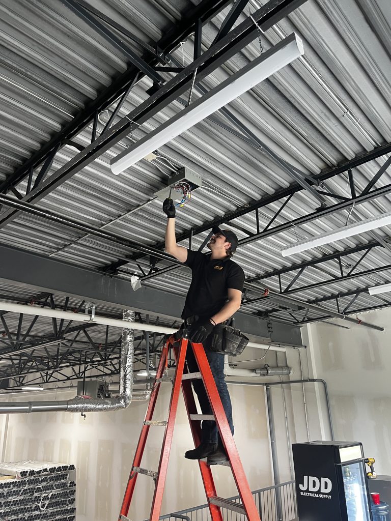 installing overhead lights in a commercial space