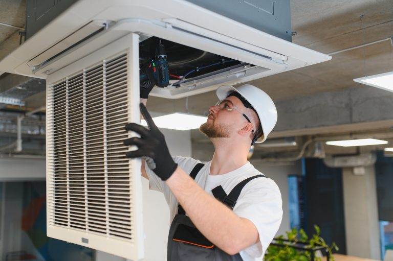 electrician installing AC system